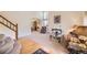 Spacious living room featuring plush carpet, high ceilings, and elegant furnishings, perfect for comfortable living at 9001 W Chatfield Dr, Littleton, CO 80128