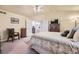 Cozy primary bedroom featuring a comfortable bed and view into the ensuite bathroom at 9001 W Chatfield Dr, Littleton, CO 80128