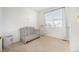 Bright Bedroom room with a crib next to a window and curtains for natural light and privacy at 7889 Yampa River Ave, Littleton, CO 80125