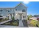 Charming townhome showcasing modern architecture, with landscaped front yard and inviting entrance at 7889 Yampa River Ave, Littleton, CO 80125