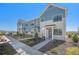 Desirable townhome featuring attractive curb appeal, a well-maintained lawn, and inviting front entrances at 7889 Yampa River Ave, Littleton, CO 80125