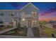 Charming townhome showcasing modern architecture, with landscaped front yard and inviting entrance at 7889 Yampa River Ave, Littleton, CO 80125