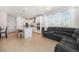 Open-concept living space with a kitchen featuring a center island, flowing into a cozy living area at 7889 Yampa River Ave, Littleton, CO 80125