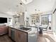 Bright and airy kitchen with stainless steel appliances, modern cabinets, and an adjacent dining area at 1898 S Bannock St # 404, Denver, CO 80223