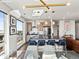 Open-concept kitchen with sleek countertops, stainless steel appliances, and a view of the dining area at 1898 S Bannock St # 404, Denver, CO 80223