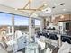Stylish kitchen and dining area with modern lighting, stainless steel appliances, and a comfortable seating at 1898 S Bannock St # 404, Denver, CO 80223