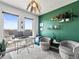 Inviting office space with dual monitors, comfortable seating, and a green accent wall at 1898 S Bannock St # 404, Denver, CO 80223