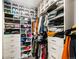 Spacious walk-in closet features custom shelving and ample storage for clothing and accessories at 1898 S Bannock St # 404, Denver, CO 80223