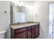 The bathroom features a granite double vanity at 4605 Copeland Loop # 103, Highlands Ranch, CO 80126