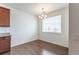 Bright dining area featuring a classic chandelier and wood flooring at 4605 Copeland Loop # 103, Highlands Ranch, CO 80126