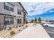 Apartment complex exterior featuring well-kept landscaping and reserved parking at 4605 Copeland Loop # 103, Highlands Ranch, CO 80126