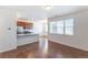 Open floor plan with modern kitchen, granite countertops, and stainless steel appliances at 4605 Copeland Loop # 103, Highlands Ranch, CO 80126