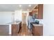 Updated kitchen featuring stainless appliances, granite countertops and modern fixtures at 4605 Copeland Loop # 103, Highlands Ranch, CO 80126