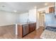 Well-equipped kitchen with stainless appliances, granite countertops, and wood flooring at 4605 Copeland Loop # 103, Highlands Ranch, CO 80126
