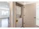 This laundry room features a stacked washer and dryer at 4605 Copeland Loop # 103, Highlands Ranch, CO 80126