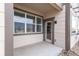 Covered patio area with concrete flooring and wood siding at 4605 Copeland Loop # 103, Highlands Ranch, CO 80126