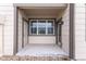 Covered patio area with concrete flooring and wood siding at 4605 Copeland Loop # 103, Highlands Ranch, CO 80126