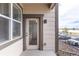 Patio with glass door and exterior view at 4605 Copeland Loop # 103, Highlands Ranch, CO 80126