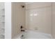 The shower features tiled walls and chrome fixtures at 4605 Copeland Loop # 103, Highlands Ranch, CO 80126