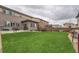 Expansive backyard with lush green grass, perfect for outdoor activities at 14315 Big Stone Dr, Parker, CO 80134