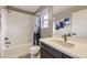 Bright bathroom with white subway tiles, a modern vanity, and a shower-tub combination at 14315 Big Stone Dr, Parker, CO 80134
