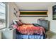 Sports themed bedroom with natural light, comfortable furnishings, and decorative wall art at 14315 Big Stone Dr, Parker, CO 80134