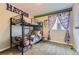 bedroom with a bunk bed, sports-themed decorations and playful design elements at 14315 Big Stone Dr, Parker, CO 80134