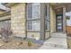 Charming home exterior featuring stone accents, a welcoming entryway, and a well-maintained landscape at 14315 Big Stone Dr, Parker, CO 80134
