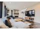 Cozy living room with a fireplace, mounted TV, and comfortable seating area at 14315 Big Stone Dr, Parker, CO 80134