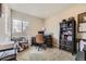 Bright office with a large window, desk, chair, and built-in bookcase at 14315 Big Stone Dr, Parker, CO 80134