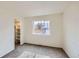 Cozy bedroom includes plush carpet, a closet for storage, and a large window at 9526 Pinebrook St, Highlands Ranch, CO 80130