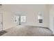 Bright living room featuring vaulted ceilings and large windows for ample natural light at 9526 Pinebrook St, Highlands Ranch, CO 80130