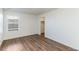 Bedroom with laminate flooring, closet, and window with natural light at 2231 Crosswind St, Fort Lupton, CO 80621