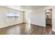 Bright bedroom with laminate flooring and an attached bathroom at 2231 Crosswind St, Fort Lupton, CO 80621