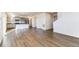 Modern kitchen with gray cabinets, granite countertops, stainless steel appliances, and a center island at 2231 Crosswind St, Fort Lupton, CO 80621