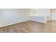 Large living room with hardwood floors, white walls, and plenty of space at 2231 Crosswind St, Fort Lupton, CO 80621