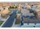 View of residential street featuring two-story homes, neighborhood park, and a distant view of the city at 11223 Jansen St, Parker, CO 80134