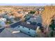 View of a neighborhood featuring two-story homes, trees, and distant construction and residential area at 11223 Jansen St, Parker, CO 80134