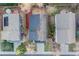 Aerial view of three fenced yards, showing patios, landscaping, and connecting walkway between two at 11223 Jansen St, Parker, CO 80134