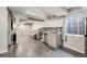 Finished basement space with kitchenette and wood-look floors at 11223 Jansen St, Parker, CO 80134