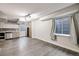 Finished basement space with kitchenette, wood-look floors, and ample natural light at 11223 Jansen St, Parker, CO 80134