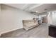 Finished basement featuring durable flooring, kitchenette, and open layout for flexible living or entertainment at 11223 Jansen St, Parker, CO 80134