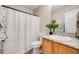 Cozy bathroom with a shower-tub combo and granite countertop vanity at 11223 Jansen St, Parker, CO 80134