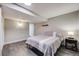 Bright bedroom with gray floors, neutral walls, and a large bed at 11223 Jansen St, Parker, CO 80134