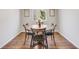 Cozy dining room with wood floors, a round table, and four chairs at 11223 Jansen St, Parker, CO 80134