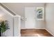 Bright entryway featuring wood floors, staircase and a decorative plant at 11223 Jansen St, Parker, CO 80134