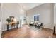 Stylish living room with high ceilings, wood floors, and a cozy seating area near a bright window at 11223 Jansen St, Parker, CO 80134