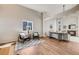 Spacious open-concept living area with wood floors and plenty of natural light at 11223 Jansen St, Parker, CO 80134
