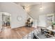 Inviting living room with high ceilings and wood flooring, complemented by stylish furnishings and natural light at 11223 Jansen St, Parker, CO 80134
