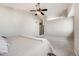 Spacious main bedroom featuring a ceiling fan, carpet, and neutral paint at 11223 Jansen St, Parker, CO 80134
